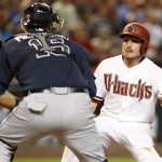 Arizona Diamondbacks Jordan Pacheco, right, gets tagged out by Atlanta Braves catcher A.J. Pierzynski (15) in the fifth inning during a baseball game, Tuesday, June 2, 2015, in Phoenix. (AP Photo/Rick Scuteri)