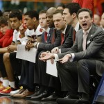 Louisville head coach Rick Pitino, right, reacts during the first half of a regional final against Michigan State in the NCAA men's college basketball tournament Sunday, March 29, 2015, in Syracuse, N.Y. (AP Photo/Seth Wenig)
