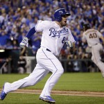 Kansas City Royals' Mike Moustakas hits a double during the third inning of Game 1 of baseball's World Series against the Kansas City Royals Tuesday, Oct. 21, 2014, in Kansas City, Mo. (AP Photo/David J. Phillip)