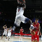 United States' Kenneth Faried, centre, dunks during the final World Basketball match between the United States and Serbia at the Palacio de los Deportes stadium in Madrid, Spain, Sunday, Sept. 14, 2014. (AP Photo/Andres Kudacki)