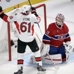 Ottawa Senators right wing Mark Stone (61) celebrates a Senators goal against Montreal Canadiens goalie Carey Price (31) during the second period of Game 5 of a first-round NHL hockey playoff series, Friday, April 24, 2015, in Montreal. (Ryan Remiorz/The Canadian Press via AP)