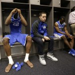 Kentucky forward Alex Poythress, left, reacts with teammates in the locker room after their 60-54 loss to Connecticut in the NCAA Final Four tournament college basketball championship game Monday, April 7, 2014, in Arlington, Texas. (AP Photo/Eric Gay)