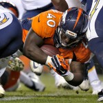 Denver Broncos running back Juwan Thompson (40) dives in for a touchdown against the San Diego Chargers during the second half of an NFL football game, Thursday, Oct. 23, 2014, in Denver. (AP Photo/Joe Mahoney)
