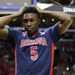 Arizona forward Stanley Johnson reacts after being called for a foul during the second half of a college basketball regional final against Wisconsin in the NCAA Tournament, Saturday, March 28, 2015, in Los Angeles. (AP Photo/Jae C. Hong)
