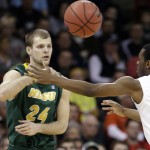  North Dakota State's Ryan Staten (24) passes as San Diego State's Xavier Thames defends in the first half during the third-round of the NCAA men's college basketball tournament in Spokane, Wash., Saturday, March 22, 2014. (AP Photo/Elaine Thompson)