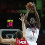 United States' Kenneth Faried, right, tries a jump shot during the final World Basketball match between the United States and Serbia at the Palacio de los Deportes stadium in Madrid, Spain, Sunday, Sept. 14, 2014. (AP Photo/Andres Kudacki)