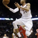 Milwaukee Bucks' Giannis Antetokounmpo shoots over Chicago Bulls' Derrick Rose during the second half of Game 3 of an NBA basketball first-round playoff series Thursday, April 23, 2015, in Milwaukee. The Bulls won 113-106 in double overtime to take a 3-0 lead in the series. (AP Photo/Morry Gash)
