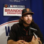 San Francisco Giants shortstop Brandon Crawford talks to media during baseball player availability at Kauffman Stadium in Kansas City, Mo., Monday, Oct. 20, 2014. The Kansas City Royals will host the San Francisco Giants in Game 1 of the World Series on Oct. 21. (AP Photo/Orlin Wagner)