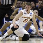 Iowa State's Matt Thomas (21) and North Carolina's Nate Britt (0) scramble for a loose ball during the first half of a third-round game in the NCAA college basketball tournament Sunday, March 23, 2014, in San Antonio. (AP Photo/David J. Phillip)