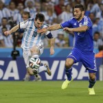  Argentina's Lionel Messi, left, in action during the group F World Cup soccer match between Argentina and Bosnia at the Maracana Stadium in Rio de Janeiro, Brazil, Sunday, June 15, 2014. (AP Photo/Thanassis Stavrakis)