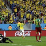 Brazil's Neymar (10) celebrates after scoring his side's second goal during the group A World Cup soccer match between Cameroon and Brazil at the Estadio Nacional in Brasilia, Brazil, Monday, June 23, 2014. (AP Photo/Natacha Pisarenko)