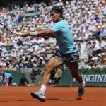 Spain's Rafael Nadal returns the ball to Serbia's Novak Djokovic during their final match of the French Open tennis tournament at the Roland Garros stadium, in Paris, France, Sunday, June 8, 2014. (AP Photo/Thibault Camus)