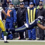 Green Bay Packers' Aaron Rodgers throws during the first half of the NFL football NFC Championship game against the Seattle Seahawks Sunday, Jan. 18, 2015, in Seattle. (AP Photo/Ted S. Warren)