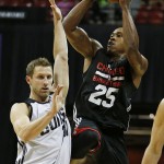 Chicago Bulls' Darrell Williams (25) shoots over Phoenix Suns' Mickey McConnell during the second half of an NBA summer league basketball game Saturday, July 18, 2015, in Las Vegas. (AP Photo/John Locher)
