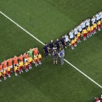 The Dutch, left, and Argentine teams line up on the pitch prior to the World Cup semifinal soccer match between the Netherlands and Argentina at the Itaquerao Stadium in Sao Paulo, Brazil, Wednesday, July 9, 2014. (AP Photo/Francois Xavier Marit, Pool)