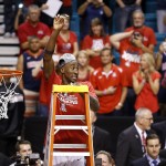 Arizona players and coaches celebrate after they defeated Oregon in an NCAA college basketball game in the championship of the Pac-12 conference tournament Saturday, March 14, 2015, in Las Vegas. Arizona defeated Oregon 80-52. (AP Photo/John Locher)