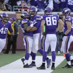 Minnesota Vikings running back Matt Asiata, second from left, celebrates with teammates after scoring on a 1-yard touchdown run in the second half of an NFL football game against the Washington Redskins, Sunday, Nov. 2, 2014, in Minneapolis. (AP Photo/Ann Heisenfelt)