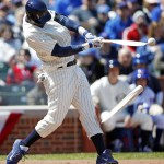 Chicago Cubs' Junior Lake breaks his bat on a single against the Arizona Diamondbacks during the first inning of a baseball game at Wrigley Field in Chicago on Wednesday, April 23, 2014. (AP Photo/Andrew A. Nelles)