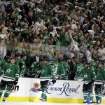 Dallas Stars fans wave rally towels as the Stars bench celebrates a goal by center Vernon Fiddler, second from bottom left, in the second period of Game 4 of a first-round NHL hockey Stanley Cup playoff series against the Anaheim Ducks, Wednesday, April 23, 2014, in Dallas. (AP Photo/Tony Gutierrez