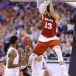 Wisconsin's Duje Dukan (13) dunks the ball over Duke defenders during the first half of the NCAA Final Four college basketball tournament championship game Monday, April 6, 2015, in Indianapolis. (AP Photo/Michael Conroy)