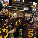 Arizona State's Zane Gonzalez (5) smiles as he celebrates his game-winning field goal against Utah with teammate Shane Till, left, after overtime in an NCAA college football game on Saturday, Nov. 1, 2014, in Tempe, Ariz. Arizona State defeated the Utah 19-16 in overtime. (AP Photo/Ross D. Franklin)