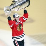 Chicago Blackhawks' Jonathan Toews hoists the Stanley Cup trophy after defeating the Tampa Bay Lightning in Game 6 of the NHL hockey Stanley Cup Final series on Wednesday, June 10, 2015, in Chicago. The Blackhawks defeated the Lightning 2-0 to win the series 4-2. (AP Photo/Charles Rex Arbogast)
