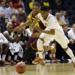  Texas guard Isaiah Taylor (1) and Arizona State guard Jermaine Marshall (34) chase a loose ball during the second half of a second-round game in the NCAA college basketball tournament Thursday, March 20, 2014, in Milwaukee. (AP Photo/Jeffrey Phelps)