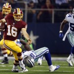 Washington Redskins' Colt McCoy (16) breaks a tackle attempt by Dallas Cowboys' Rolando McClain (55) as Bruce Carter (54) watches during the second half of an NFL football game, Monday, Oct. 27, 2014, in Arlington, Texas. (AP Photo/Tim Sharp)
