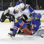 Pittsburgh Penguins' Daniel Winnik (26) and Rob Scuderi (4) check New York Rangers' Chris Kreider (20) during the second period of Game 5 in the first round of the NHL hockey Stanley Cup playoffs, Friday, April 24, 2015, in New York. (AP Photo/Frank Franklin II)