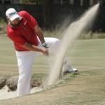 Brendon De Jonge, of Zimbabwe, hits out of the bunker on the third hole during the final round of the U.S. Open golf tournament in Pinehurst, N.C., Sunday, June 15, 2014. (AP Photo/Charlie Riedel)