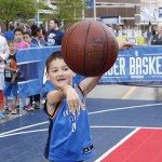 Lucas Kever, age six, of Edmond, Okla., throws the basketball in the Oklahoma City Thunder fan-fest outside the arena before the start of Game 2 of an opening-round NBA basketball playoff series between the Memphis Grizzlies and the Thunder in Oklahoma City, Monday, April 21, 2014. (AP Photo/Sue Ogrocki)
