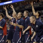Belmont players react on the bench to a teammate's basket against Virginia during the first half of an NCAA tournament college basketball game in the Round of 64 in Charlotte, N.C., Friday, March 20, 2015. (AP Photo/Gerald Herbert)