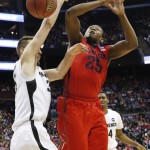 Dayton's Kendall Pollard (25) loses the ball against Providence's Carson Desrosiers in the first half of an NCAA tournament college basketball game in the Round of 64 in Columbus, Ohio, Friday, March 20, 2015. (AP Photo/Paul Vernon)