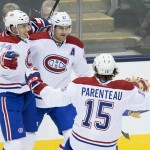 Montreal Canadiens', from left to right, Alexei Emelin, Max Paciorretty and Pierre-Alexandre Parenteau celebrate Paciorretty's goal during first-period NHL hockey game action against the Toronto Maple Leafs in Toronto, Wednesday, Oct. 8, 2014. (AP Photo/The Canadian Press, Darren Calabrese)