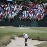 Phil Mickelson hits out of the bunker on the ninth hole during the third round of the U.S. Open golf tournament in Pinehurst, N.C., Saturday, June 14, 2014. (AP Photo/David Goldman)