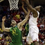  Wisconsin forward Nigel Hayes grabs a rebound against Oregon forward Ben Carter (32) during the first half of a third-round game of the NCAA college basketball tournament Saturday, March 22, 2014, in Milwaukee. (AP Photo/Jeffrey Phelps)