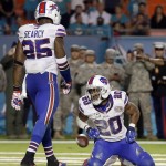 Buffalo Bills cornerback Corey Graham (20) reacts after missing an interception in the second half of an NFL football game against the Miami Dolphins in Miami Gardens, Fla., Thursday, Nov. 13, 2014. (AP Photo/Alan Diaz)