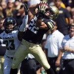 Colorado wide receiver Nelson Spruce, right, pulls in pass for touchdown as Hawaii defensive back Dee Maggitt covers during the first quarter of an NCAA college football game in Boulder, Colo., Saturday, Sept. 20, 2014. (AP Photo/David Zalubowski)