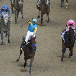 Victor Espinoza rides American Pharoah to victory in the 141st running of the Kentucky Derby horse race at Churchill Downs Saturday, May 2, 2015, in Louisville, Ky. (AP Photo/Charlie Riedel)