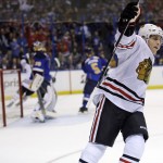 Chicago Blackhawks' Patrick Kane celebrates after scoring during the first period in Game 1 of a first-round NHL hockey Stanley Cup playoff series against the St. Louis Blues on Thursday, April 17, 2014, in St. Louis. (AP Photo/Jeff Roberson)
