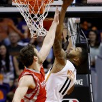 Phoenix Suns' Markieff Morris (11) battles Houston Rockets' Donatas Motiejunas, of Lithuania, for the ball during the first half of an NBA basketball game Tuesday, Feb. 10, 2015, in Phoenix. (AP Photo/Ross D. Franklin)