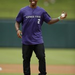 TCU quarterback Trevone Boykin smiles as he stands on the mound before throwing out the ceremonial first pitch before an interleague baseball game between the Arizona Diamondbacks and Texas Rangers Wednesday, July 8, 2015, in Arlington, Texas. (AP Photo/Tony Gutierrez)
