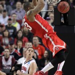 Ohio State center Amir Williams scores over Arizona guard T.J. McConnell during an NCAA college basketball tournament round of 32 game in Portland, Ore., Saturday, March 21, 2015. (AP Photo/Craig Mitchelldyer)