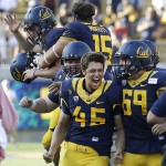 California's James Langford (45) celebrates with teammates after making the game-winning field goal against Colorado in overtime of an NCAA college football game Saturday, Sept. 27, 2014, in Berkeley, Calif. (AP Photo/Ben Margot)
