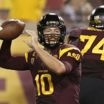 Arizona State's Taylor Kelly (10) gets ready to throw a pass against Utah in the first half of an NCAA college football game on Saturday, Nov. 1, 2014, in Tempe, Ariz. (Photo/Ross D. Franklin)
