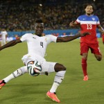 Ghana's Daniel Opare, left, clears the ball away from United States' Jermaine Jones during the group G World Cup soccer match between Ghana and the United States at the Arena das Dunas in Natal, Brazil, Monday, June 16, 2014. (AP Photo/Petr David Josek)