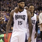 Sacramento Kings center DeMarcus Cousins, left, is congratulated by teammate Ben McLemore after Cousins scored the winning shot at the buzzer to beat the Phoenix Suns 85-83 in an NBA basketball game in Sacramento Calif., Sunday, Feb. 8, 2015. (AP Photo/Rich Pedroncelli)