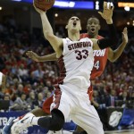 Stanford forward Dwight Powell (33) shoots as Dayton guard Jordan Sibert (24) looks on during the second half in a regional semifinal game at the NCAA college basketball tournament, Thursday, March 27, 2014, in Memphis, Tenn. (AP Photo/Mark Humphrey)