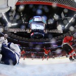 Chicago Blackhawks' Duncan Keith, right, celebrates after scoring past Tampa Bay Lightning goalie Ben Bishop, left, during the second period in Game 6 of the NHL hockey Stanley Cup Final series on Monday, June 15, 2015, in Chicago. (Bruce Bennett/Pool Photo via AP)
