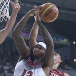 DeMarcus Cousins of the U.S, left, shoots over Mexico's Marco Ramos during Basketball World Cup Round of 16 match between United States and Mexico at the Palau Sant Jordi in Barcelona, Spain, Saturday, Sept. 6, 2014. The 2014 Basketball World Cup competition will take place in various cities in Spain from Aug. 30 through to Sept. 14. (AP Photo/Manu Fernandez)